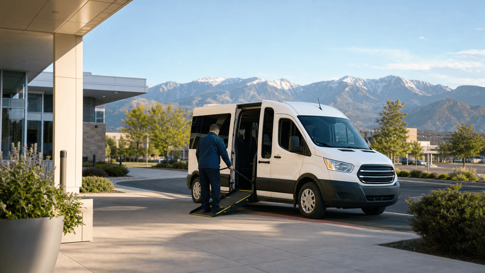 Wheelchair-accessible medical transport van at a clinic curb